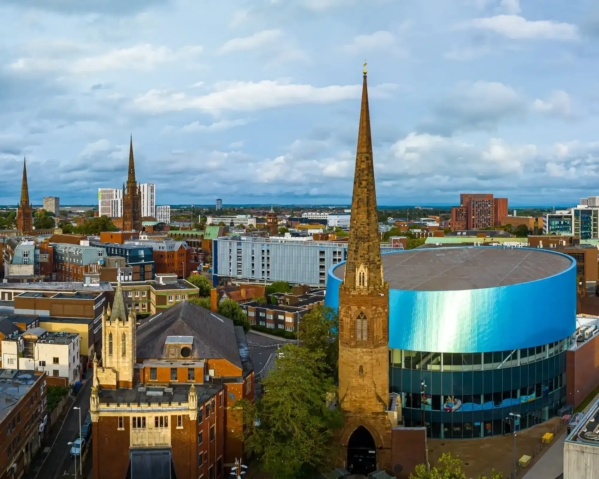 Aerial view of Coventry city centre, featuring the cathedral spire, home to our conveyancing solicitors