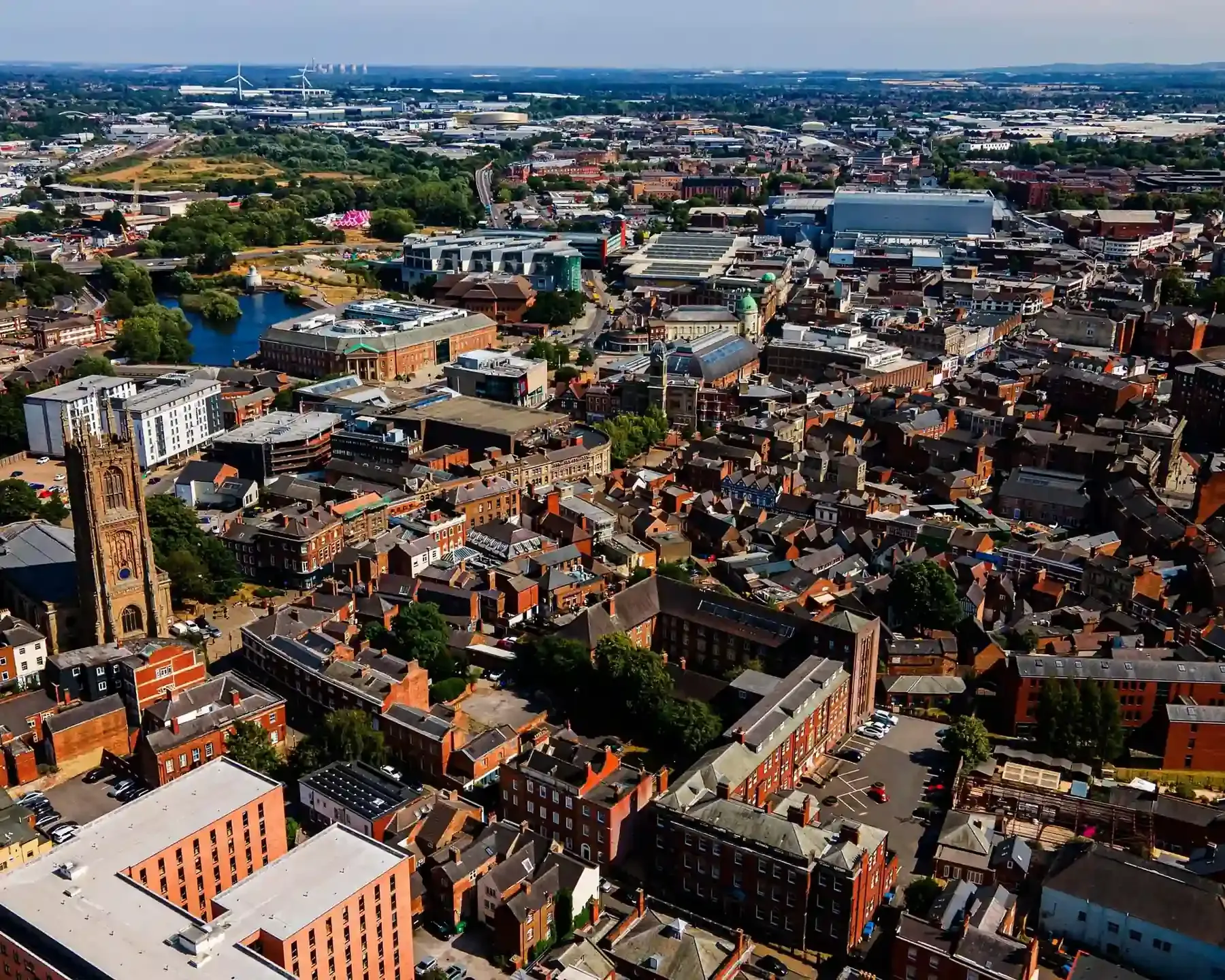 Aerial view of Derby city centre, featuring the Cathedral tower and River Derwent